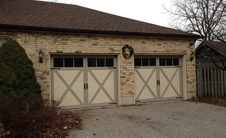 brick house with dual garage doors