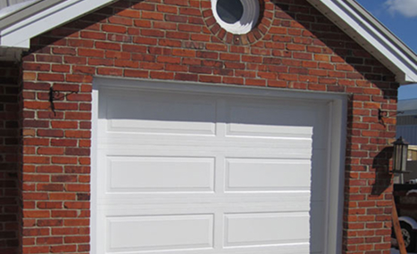 brick house with white garage door