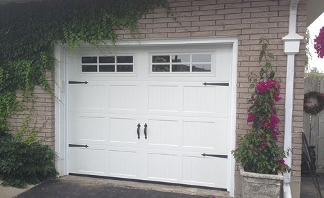 brick house with white garage door