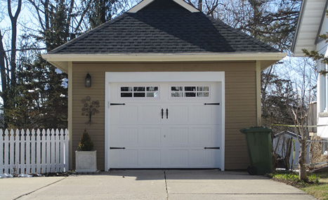 brown garage with white garage door