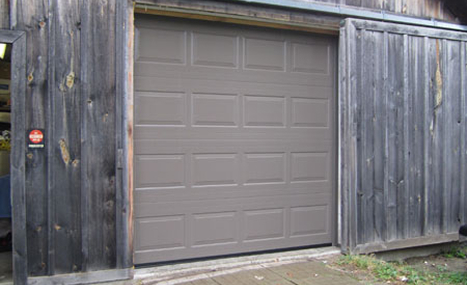 wood barn with brown garage door